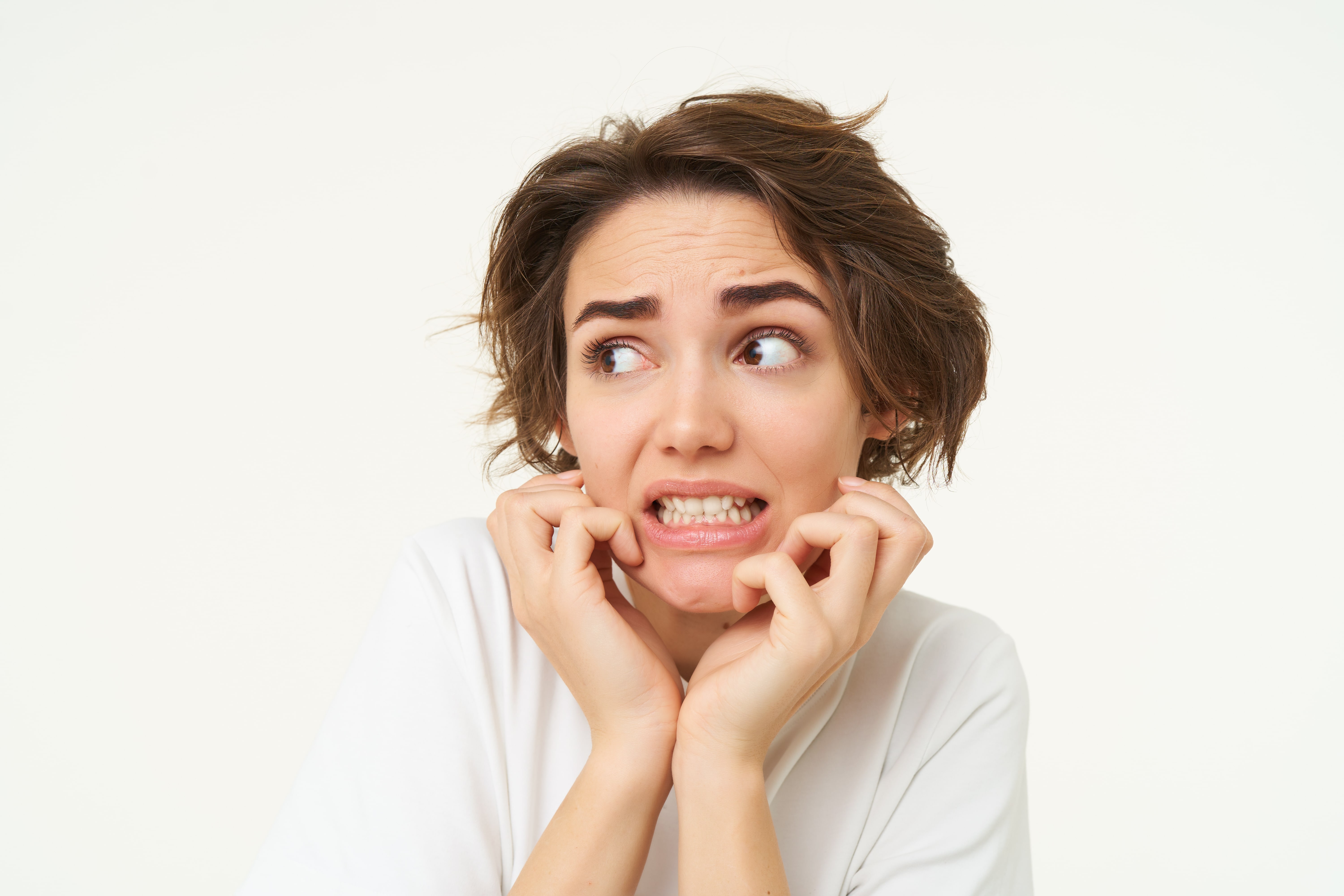 close-up-scared-brunette-woman-shaking-from-fear-looking-concerned-frightened-standing-min