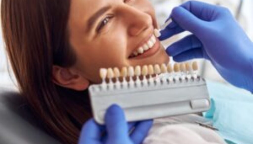 male-doctor-stand-upon-client-put-artificial-teeth-true-ones-whitening-procedure-tooth-replacing-min