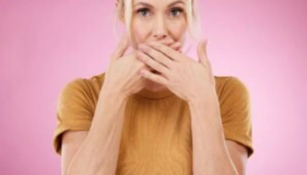 secret-studio-woman-with-her-hand-her-mouth-with-shock-surprise-quiet-face-expression-gossip-shocked-portrait-female-model-with-surprised-gesture-isolated-by-pink-background-min secret-studio-woman-with-her-hand-her-mouth-with-shock-surprise-quiet-face-expression-gossip-shocked-portrait-female-model-with-surprised-gesture-isolated-by-pink-background-min